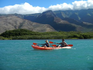 two kayakers paddling
